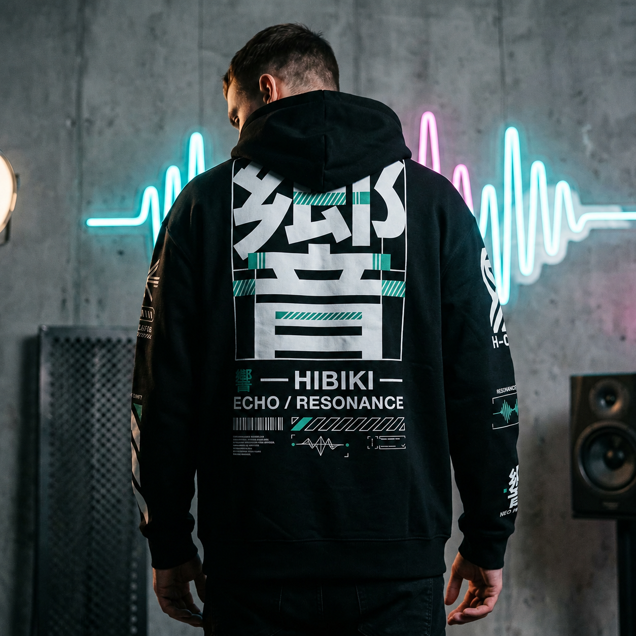 Person wearing a black hoodie with 'HIBIKI' branding in a neon-lit room.