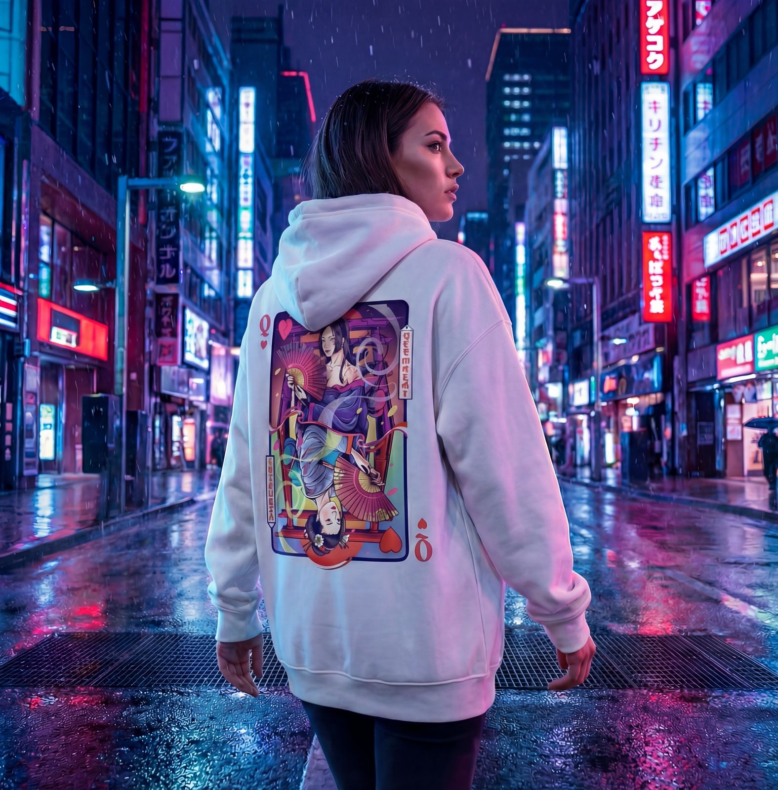 Person wearing a hoodie with a colorful design in a neon-lit city street