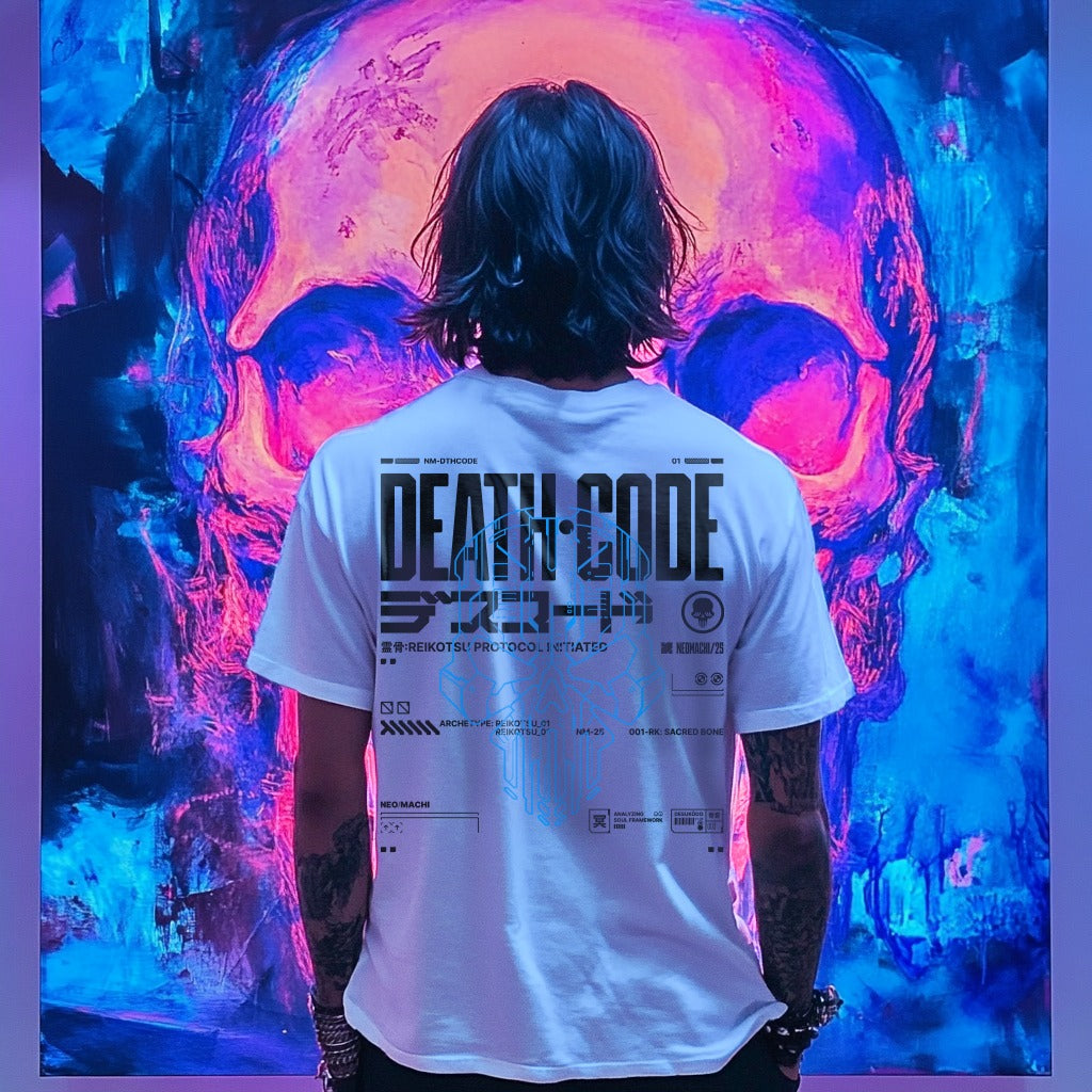 Person wearing a white 'DEATH CODE' t-shirt in front of a colorful skull mural.